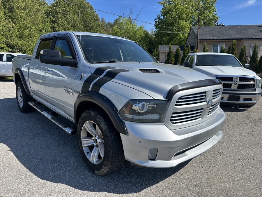 Silver 2014 RAM 1500 Pickup Truck Four-Wheel Drive 8-Speed Automatic